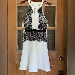 BNWT WHITEsleeveless dress accented with black lace appliqué & keyhole neckline